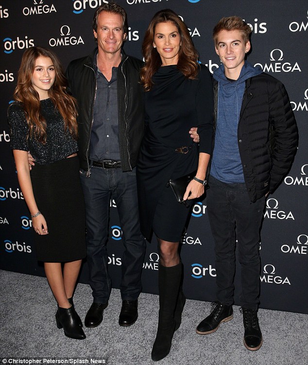 Role model: Cindy, pictured in New York this month with husband Rande Gerber and their children Presley, 15, and  Kaia, 13, told Marie Claire that is her daughter who inspires her to maintain a healthy body image