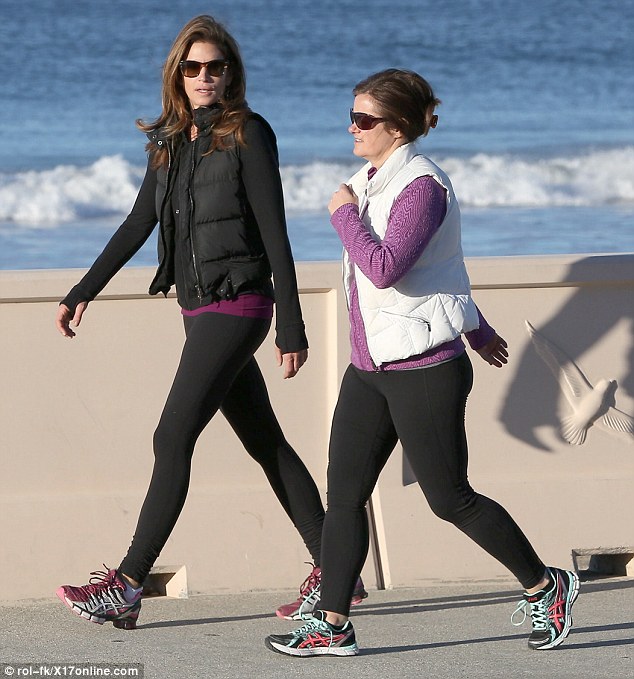 Striding out: Cindy Crawford made the most of a beautiful Tuesday morning on a hike with a friend along Zuma Beach, 36 miles north of Los Angeles